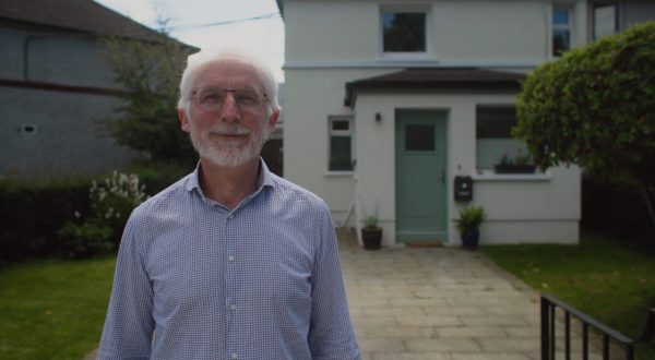 Homeowner Greg in front of his house